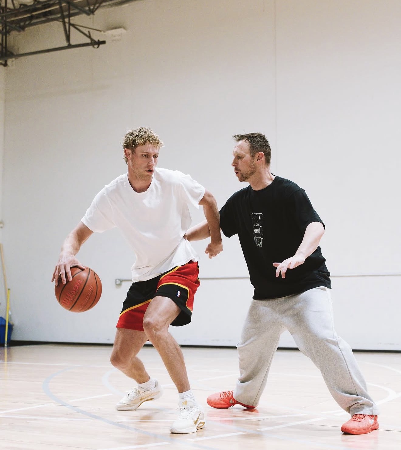 Coach Tanner Lind training a player